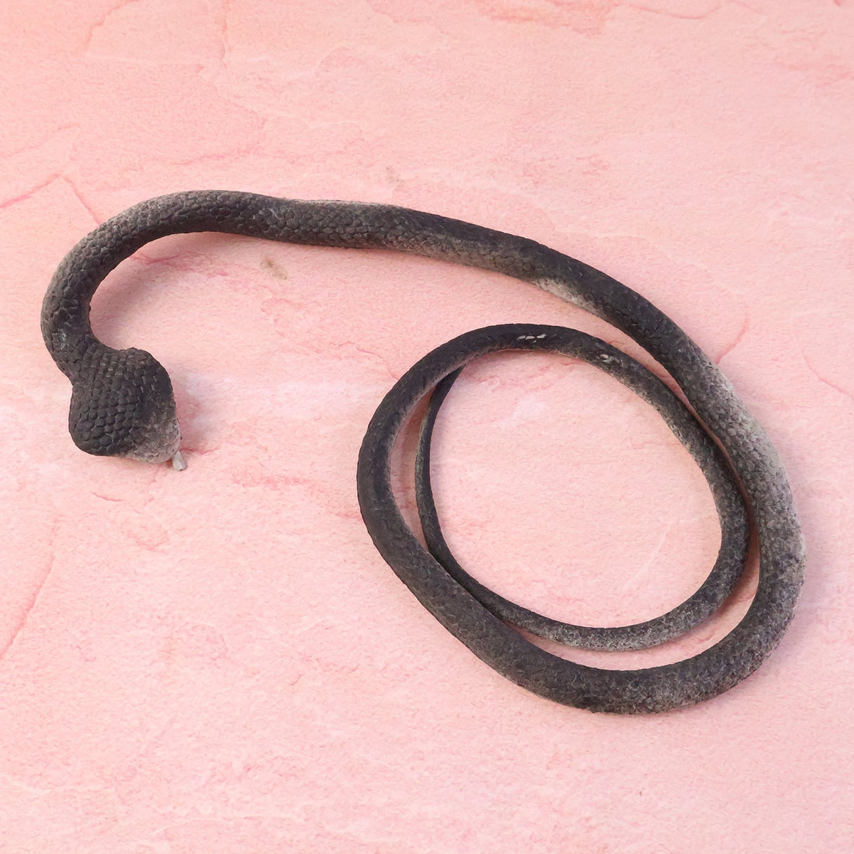Lifelike fake snake toy designed for kidsβ pranks and garden protection